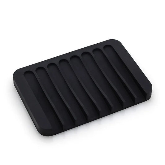 Porte-savon de douche noir en silicone, avec design élégant et fonction anti-dérapante. Idéal pour une utilisation facile et un séchage rapide