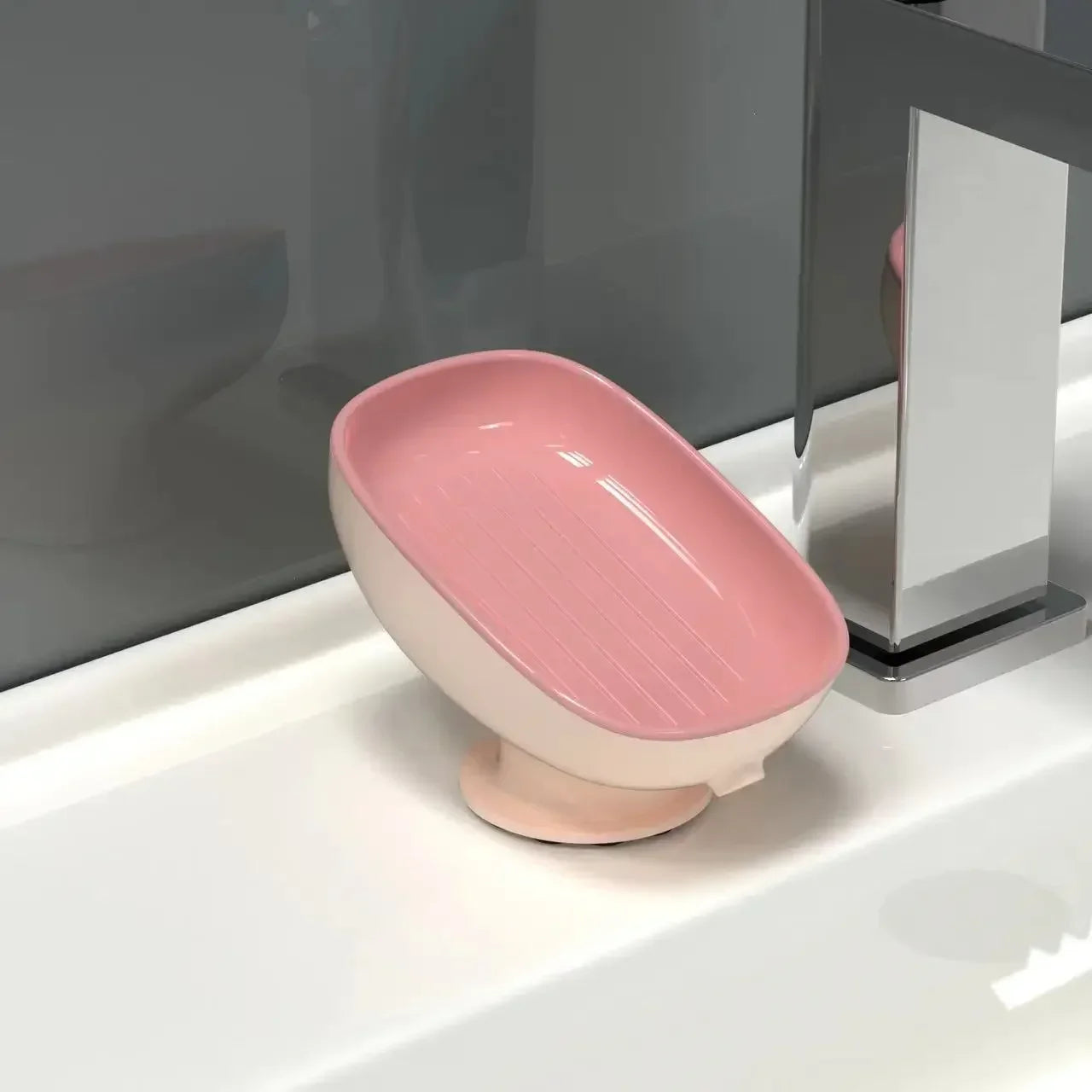 porte savon sur pied rose avec ecoulement dans l'évier